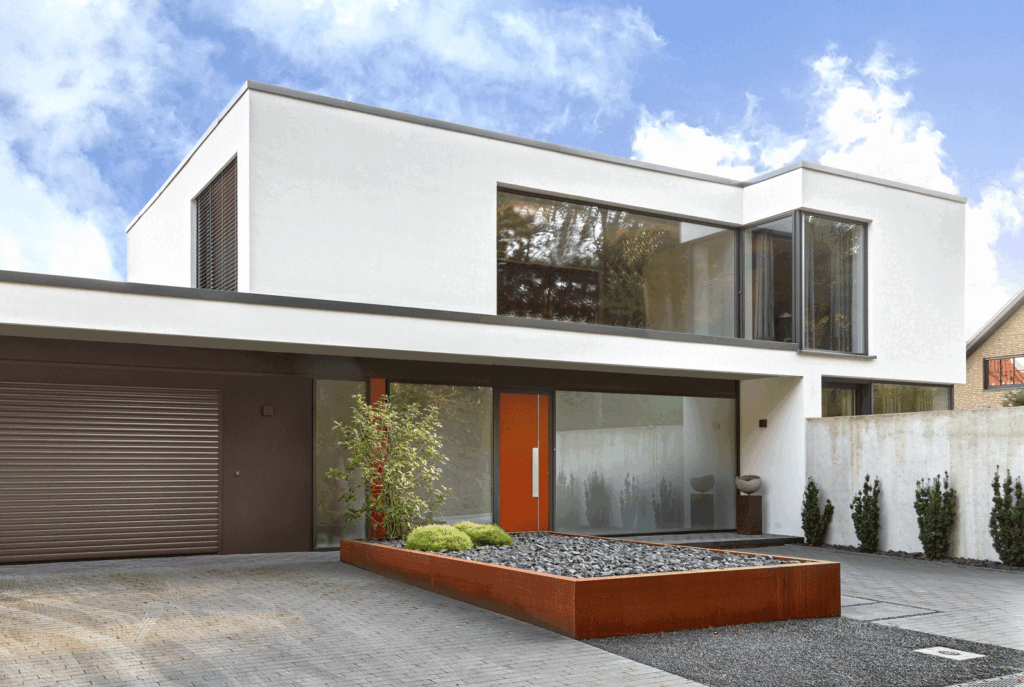 Das Bild zeigt ein sehr modernes Villa mit einer großen Fensterfront. PAGA GmbH Dortmund